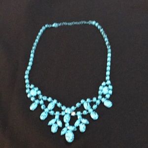 Turquoise tone necklace. Has one stone missing see pic